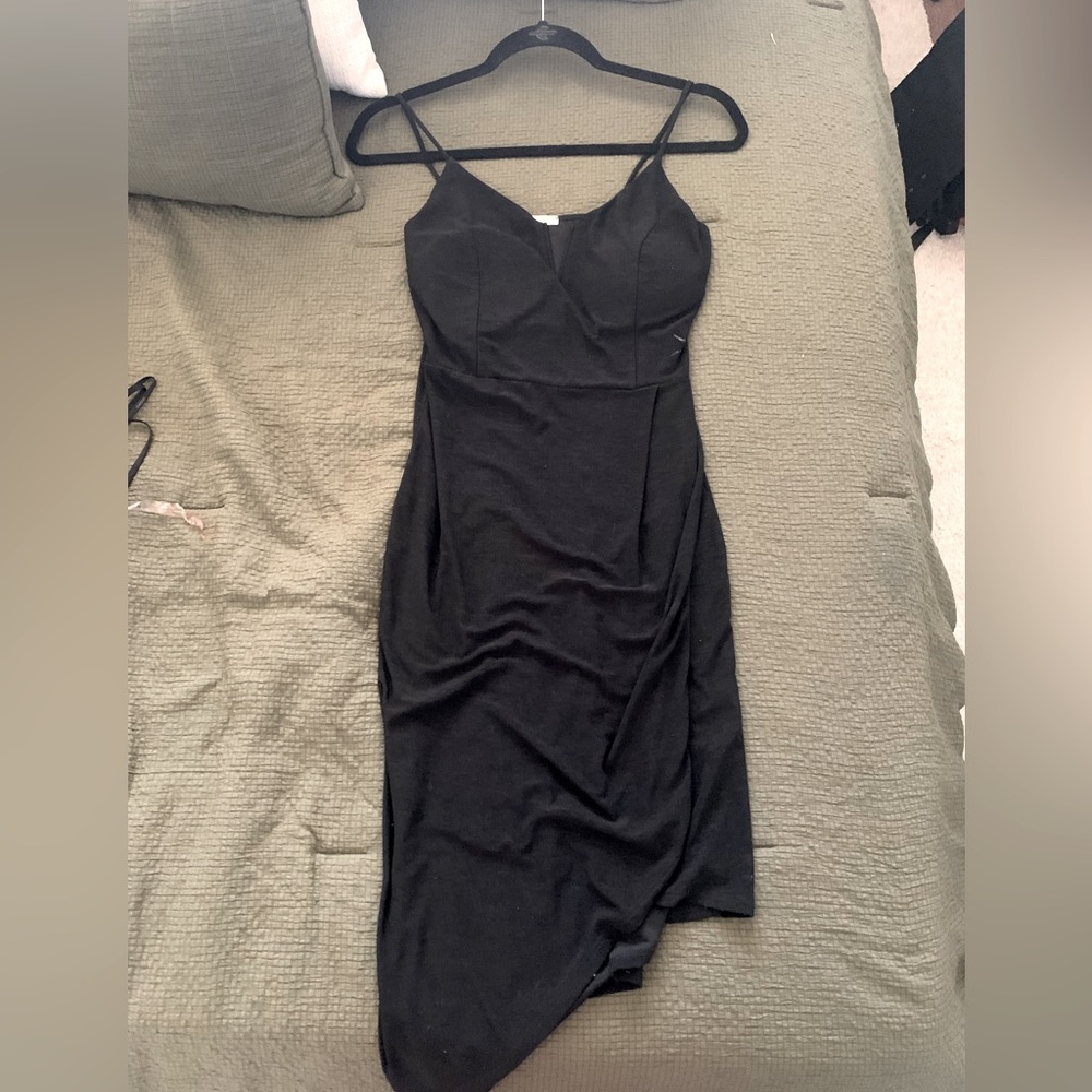 Black asymmetrical dress. Wore to a wedding once. In great condition.